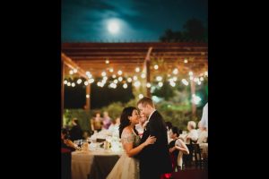 Unposed-documentary-moment-for-couple-talking-intimateky-under-the-San-Antonio-Texas-moonlight-photographed-with-a-Leica-M10-and-a-Noctilux-50mm-at-Paesanos-1604-L1001517