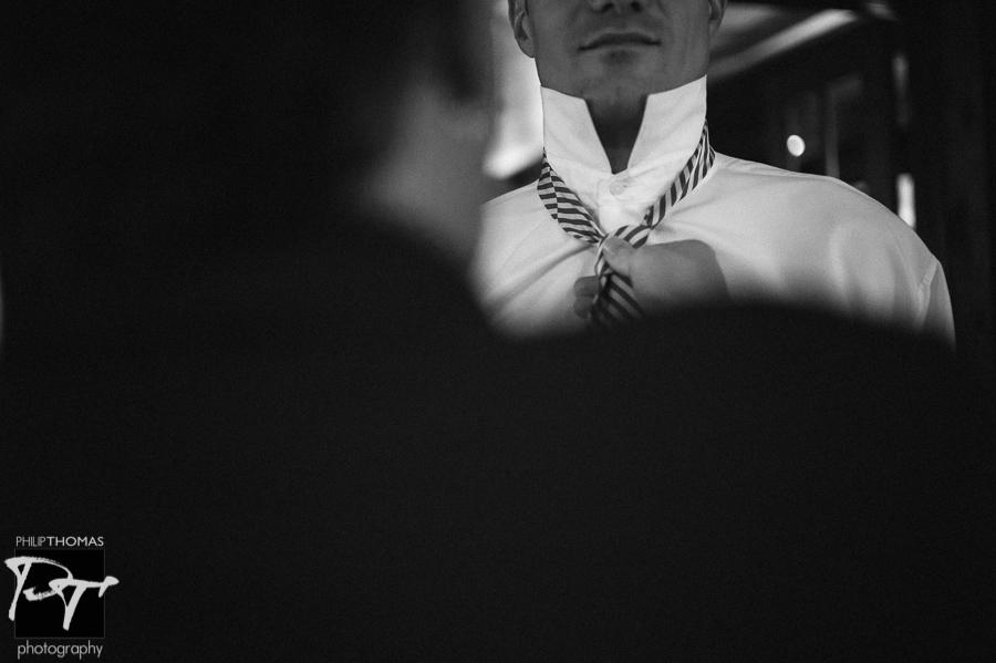 Groom getting ready. Photo by Philip Thomas Photography
