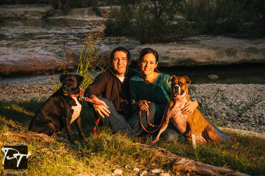 Couple and their dogs at Bull Creek, Austin. Photographed by Philip Thomas