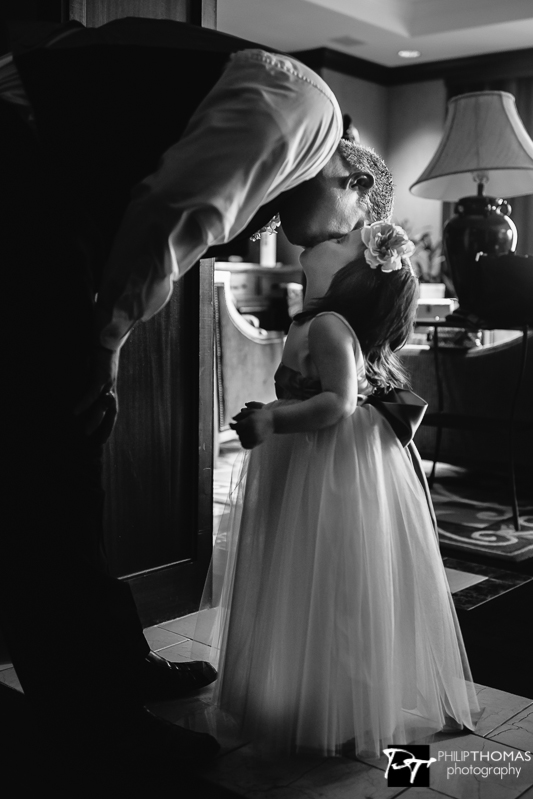 A father and daughter kiss - Philip Thomas Photography