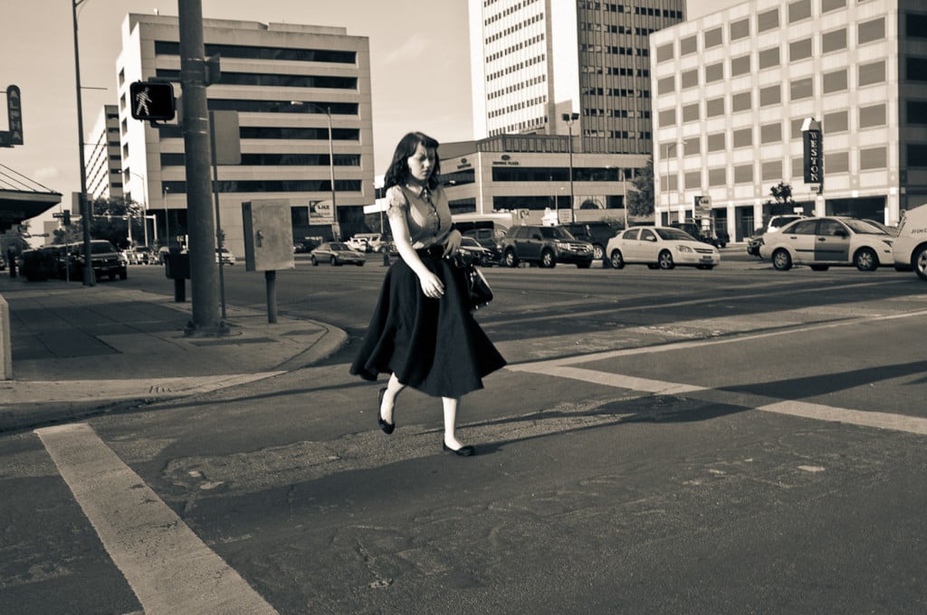 Girl crossing street downtown San Antonio