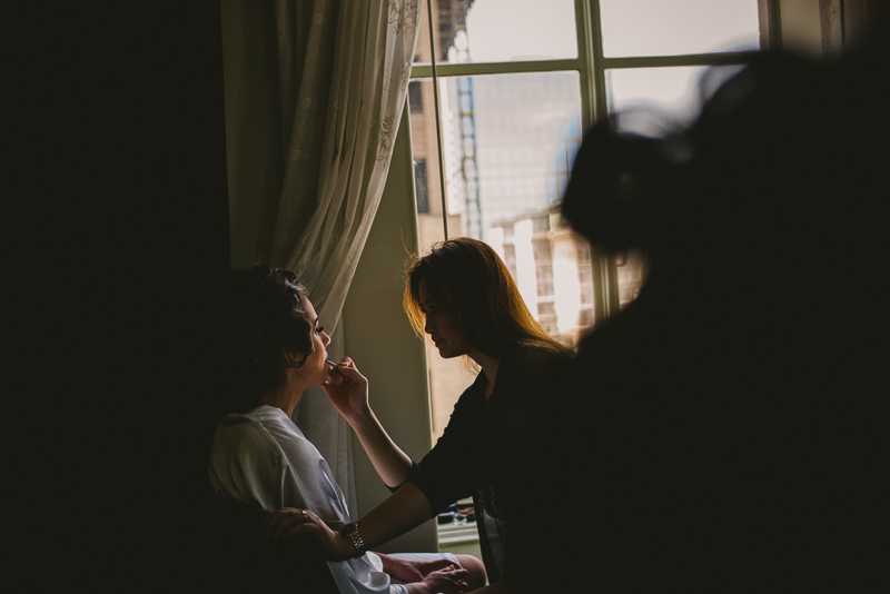 Applying makeup at The Magnolia Hotel, Houston