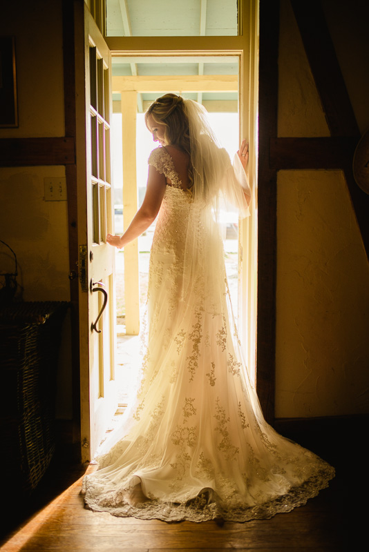 bride stands in doorway