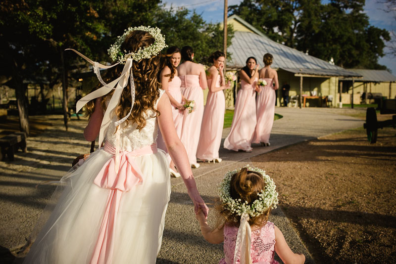 bridesmaids walk toward ceremony at kendall creek