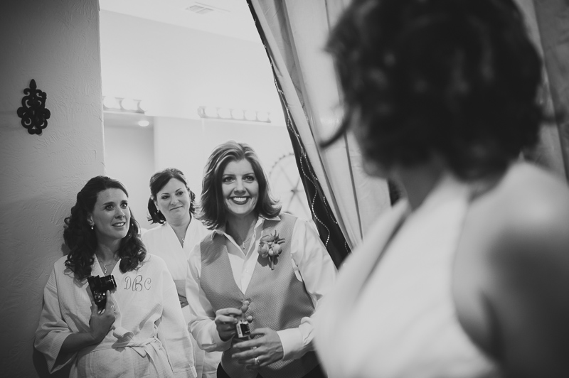 Friends look on bride at Bella Springs