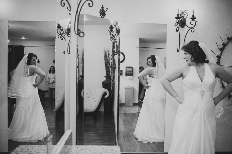 Bride looks in mirror at Bella Springs