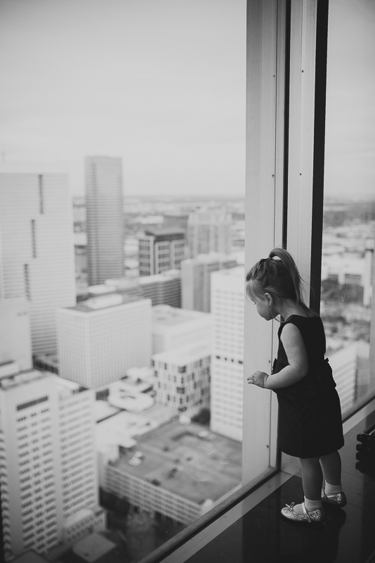 Little girl looks out at Petroleum Club