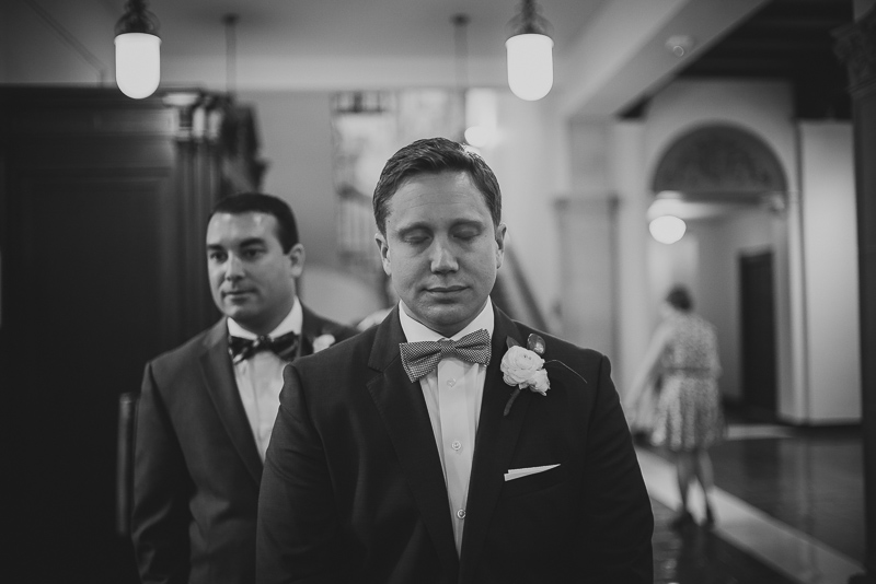 Groom closes eyes - Philip Thomas Photography - Houston wedding photographer- w wedding at Julia Ideson Library