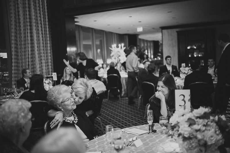 Grandmother and mother kiss at Petroleum Club