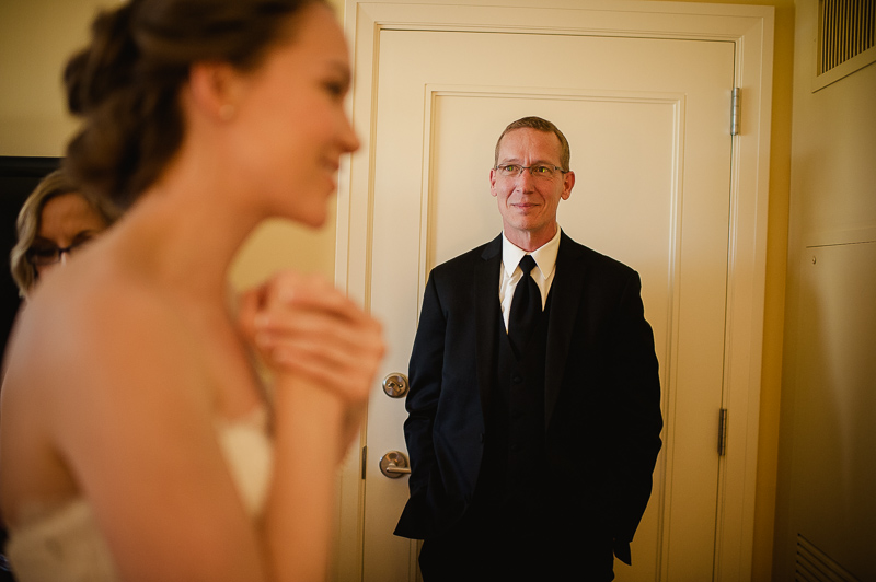 An emotional father seeing his daughter for first time on wedding day