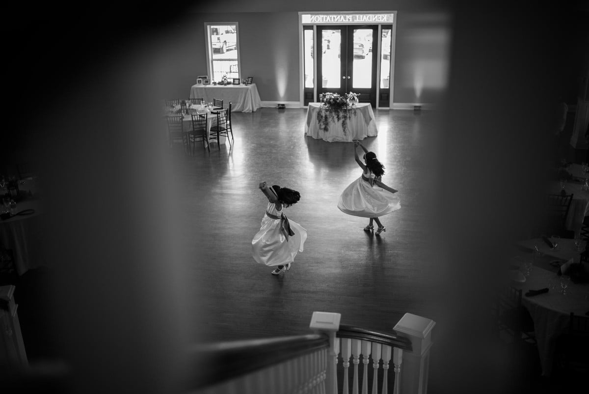 Girls twirling during wedding reception at Kendall Plantation, Hill Country, Texas