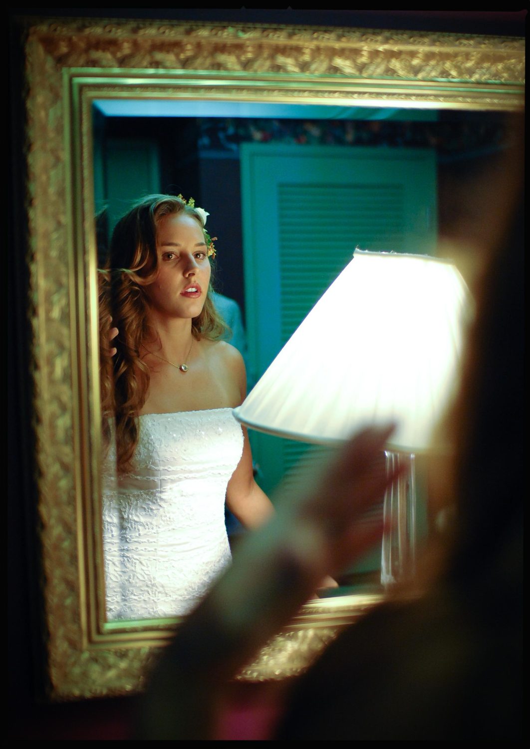 Beautiful bride checks in mirror before wedding ceremony in San Antonio Texas