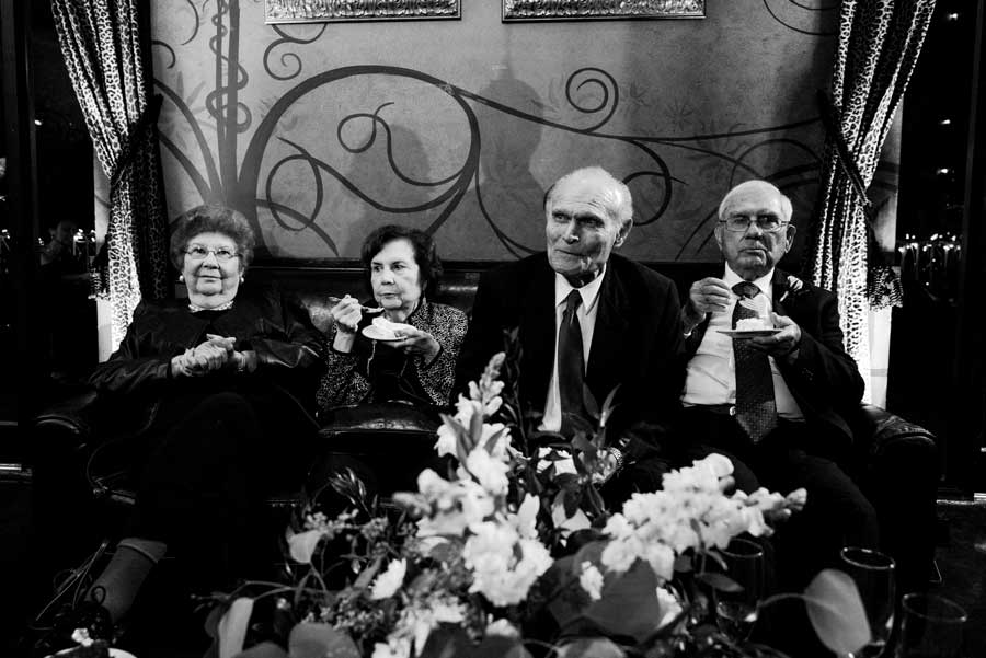 Relatives of the bride and groom eating cake at Rio Plaza reception, San Antonio, Texas. Photographed with a Leica M(240).