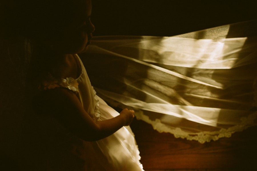 Brides veil catches sun light at Don Strange Flower Girl