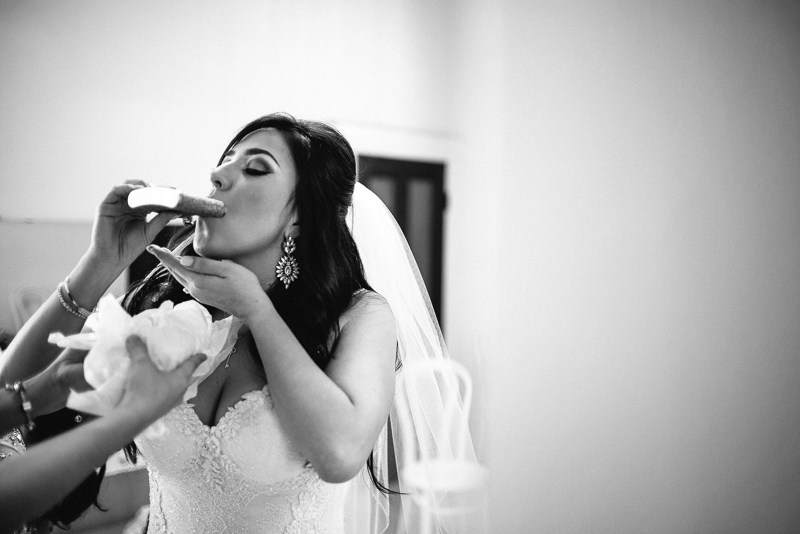 Bride takes a drink - San Antonio wedding photographer. Philip Thomas