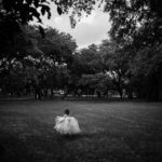 A little girl walks into a field at The Verandah San Antonio Leica Wedding Photographer - A 100 Weddings Later by Philip Thomas