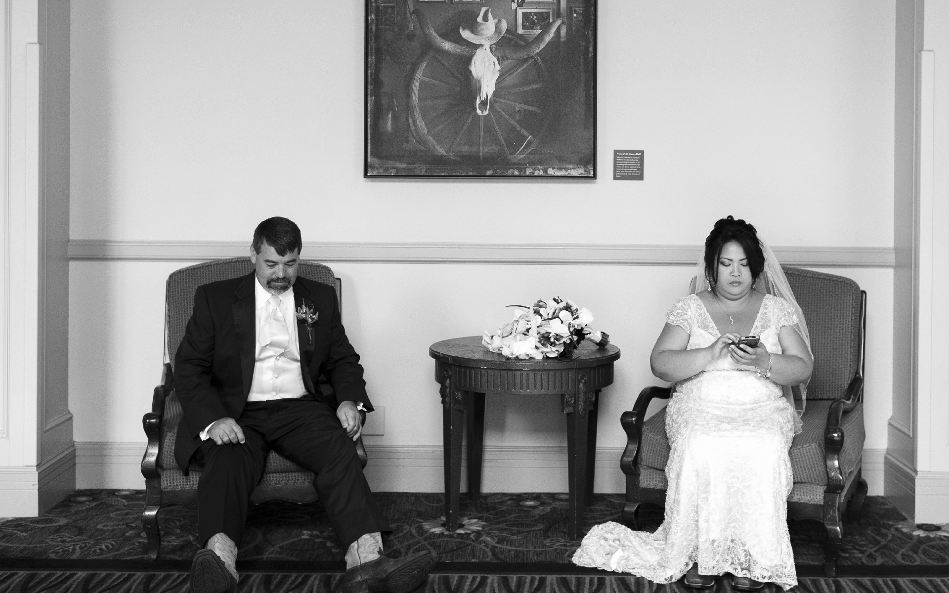 Bored couple just married sit apart at La Cantera Resort San Antonio Texas