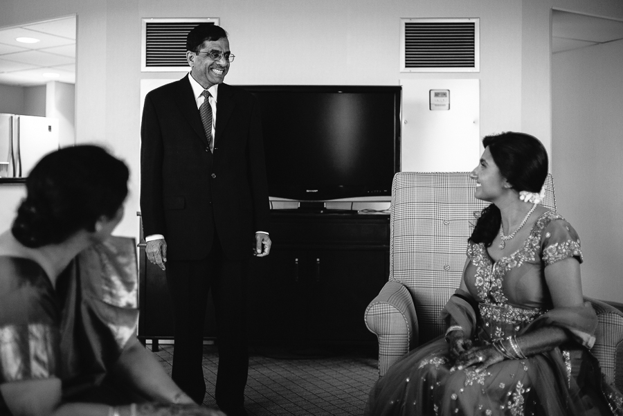 Father of the bride beaming smile to daughter