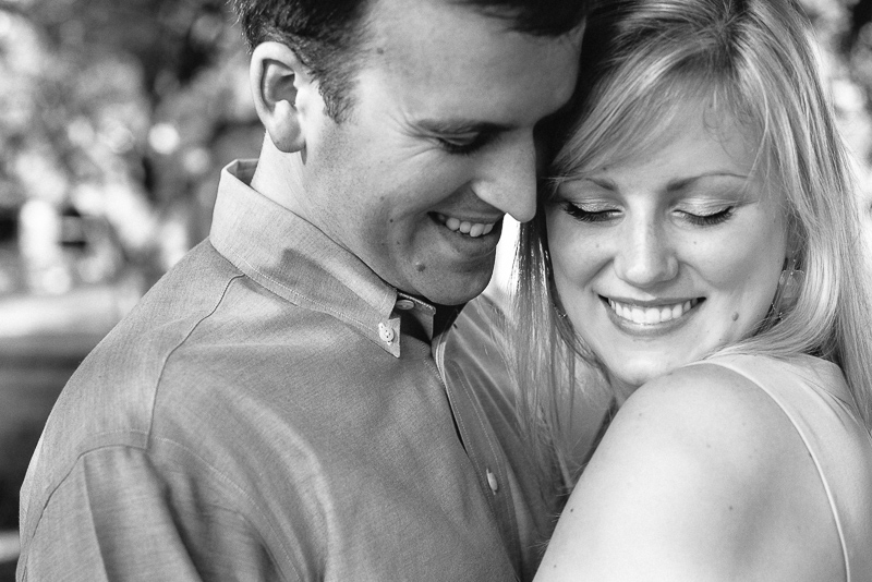 Tender moment between couple during engagement session at Rice University