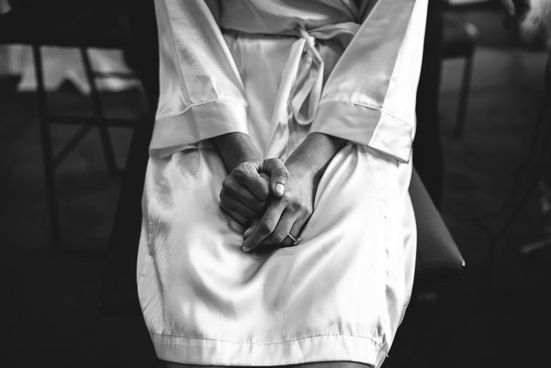 Bride pensively holding hands at W Hotel, Austin