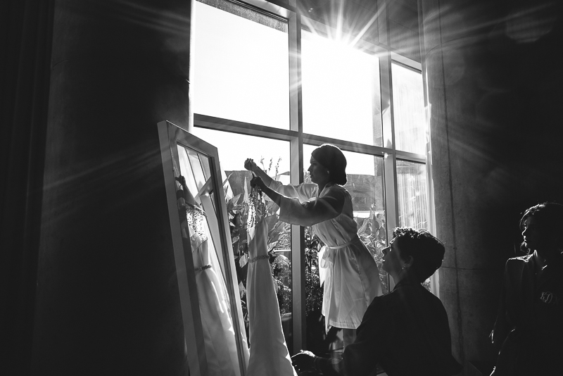 Bride hanging her dress at W Hotel, Austin, Texas