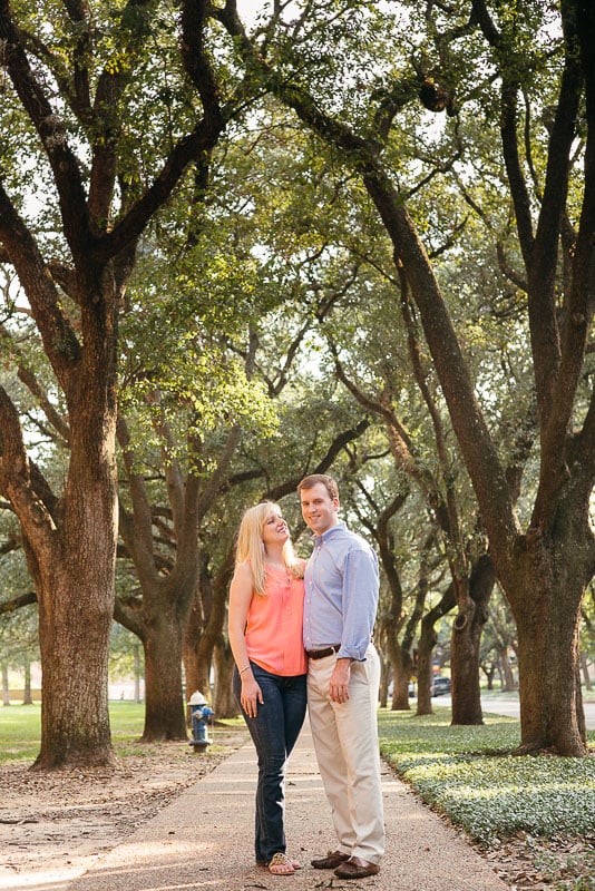 A couple posing at Rice University for engagement pics
