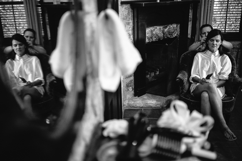 Bride getting ready in mirrored relection