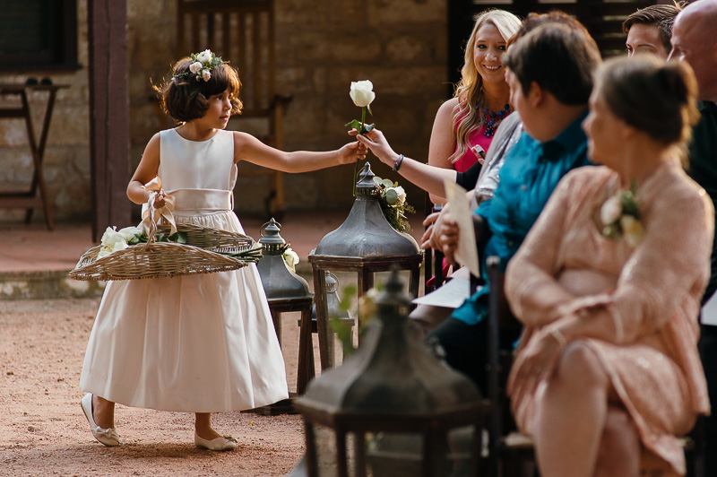 Flower girl passing out flowers wedding ceremony Hoffman Haus