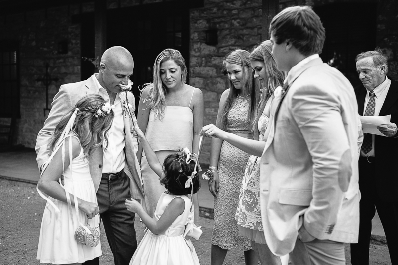 Humorous moments as flower girl pokes groom with flower