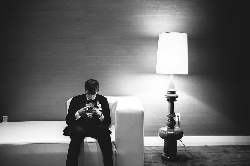 During wedding at W Hotel, young man alone
