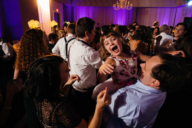 Flower girl laughing on reception floor