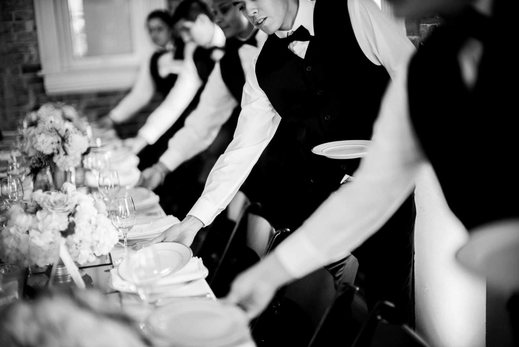 Servers set dinner plates ISPWP 2016 Award Winning Image 2nd Place Decisive moment