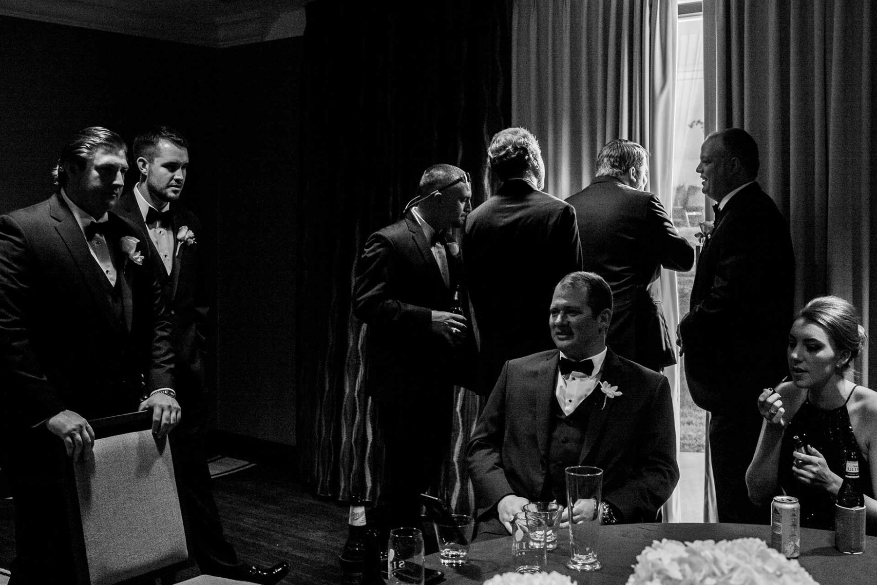 During final preperations at La Cantera in San Antonio the groom and groomsmen look out window similar ti The Godfather movie scene