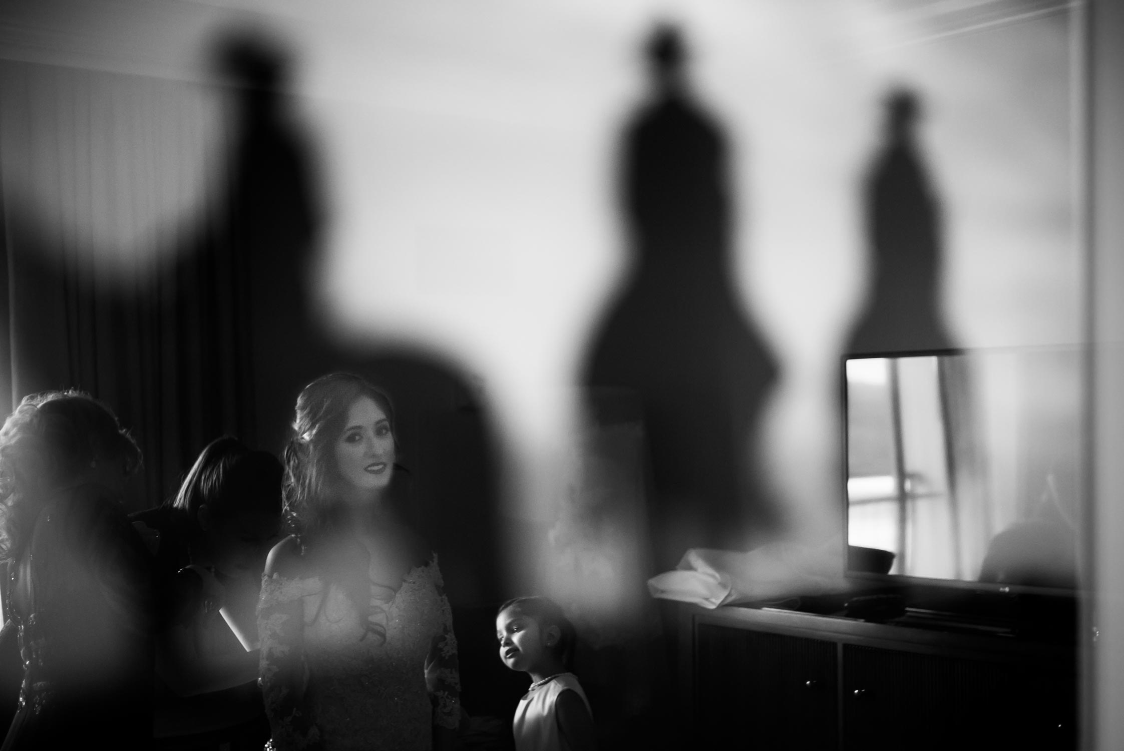 Bride gets ready in reflection of a room mirror at La Cantera Resort San Antonio Wedding Photography Philip Thomas