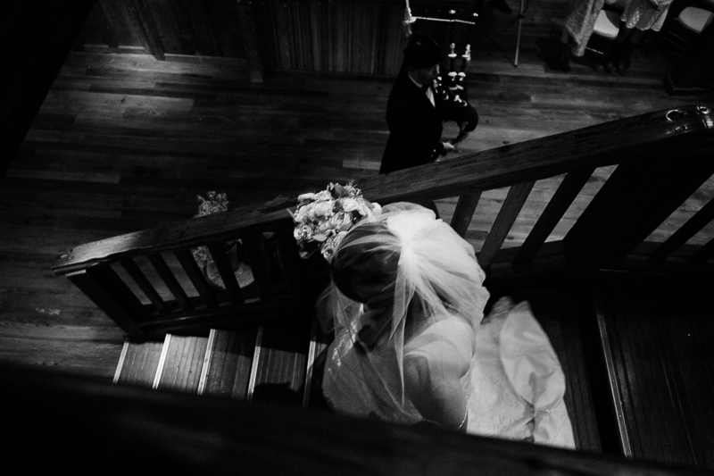 Bride on way to ceremony down stair case