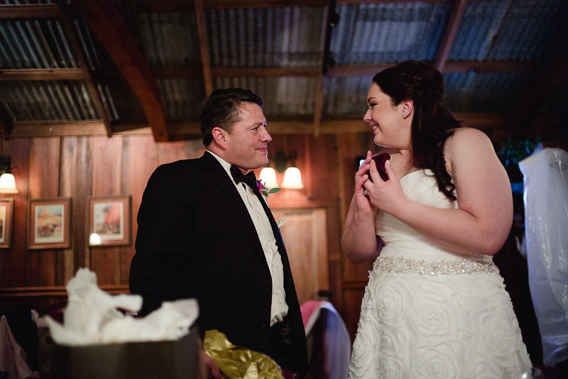 Bride and groom sharing gifts Welfare Cafe wedding