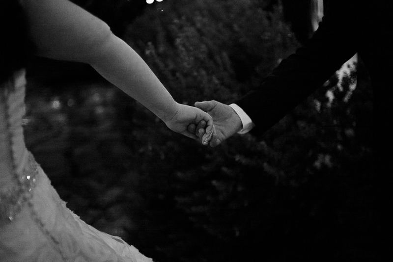 Couple holdinghands at Welfare Cafe wedding reception