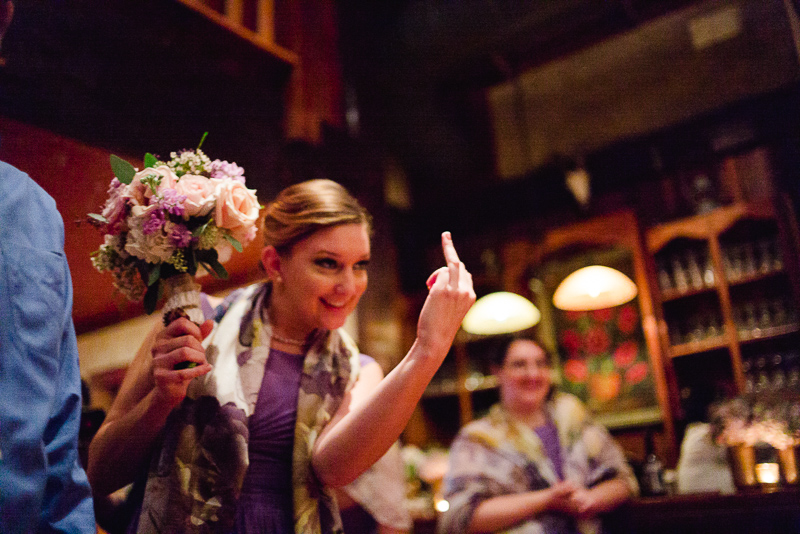 Bridesmaid giving the ring finger at Welfare Cafe wedding