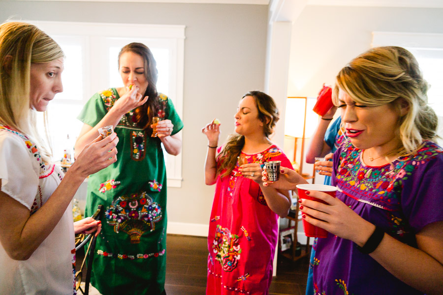 Bride and bridesmaids toasting a shot and reactions