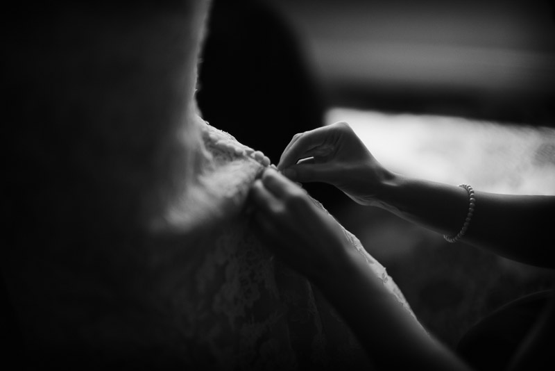 Tying the bridal dress at Omni Houston Hotel