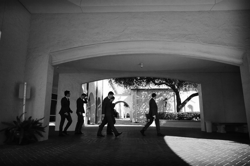 Groom and groomsmen walk St. Anne Catholic Church, 2140 Westheimer Rd, Houston