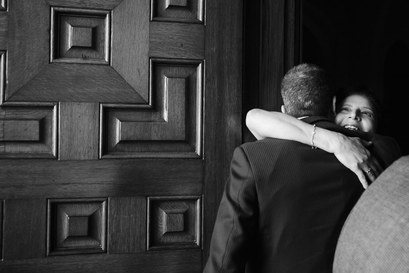 Mother of the bride greets family member at St. Anne Catholic Church, Westheimer Rd