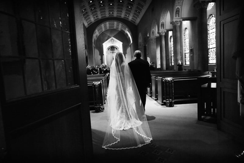 Bride and father enter the church St. Anne Catholic Church, Houston