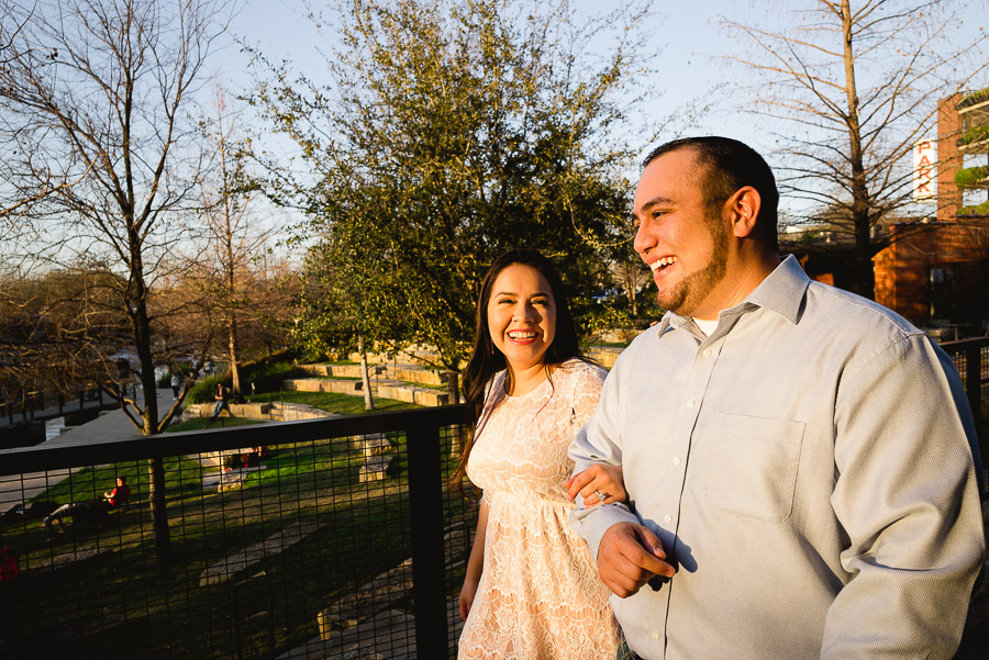 Pearl Brewery engagement walking across bridge