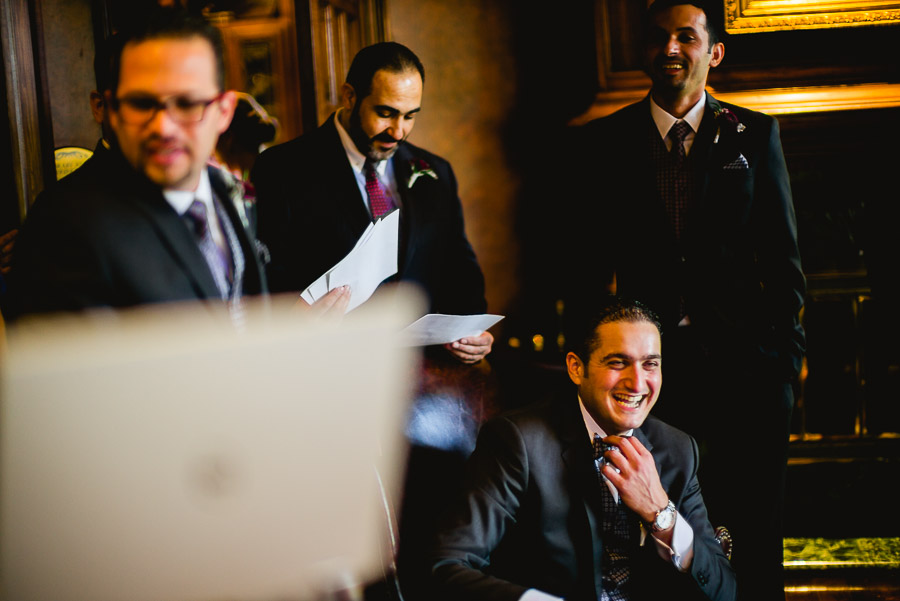 Groom surrounded by friends Dominion Country Club Wedding