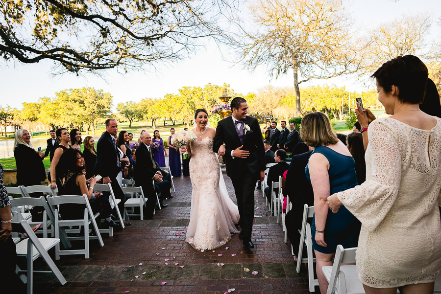 Bride and groom walking down the aisle