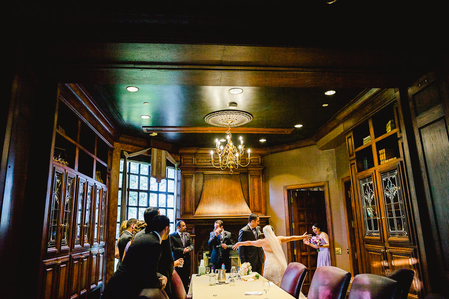 Bride and bridesmaid greet in the Boardroom at Dominion Country Club Wedding