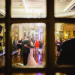 First Dance through window Dominion Country Club Wedding Reception