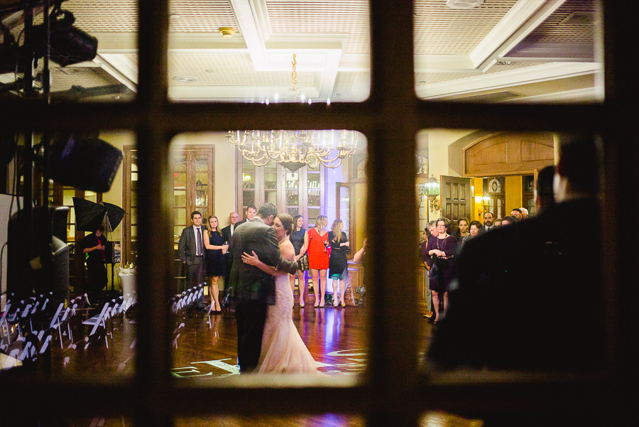 First Dance through window Dominion Country Club Wedding Reception