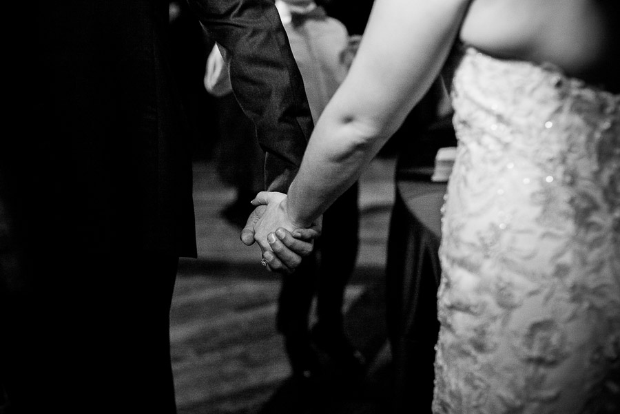 Bride and groom holding hands